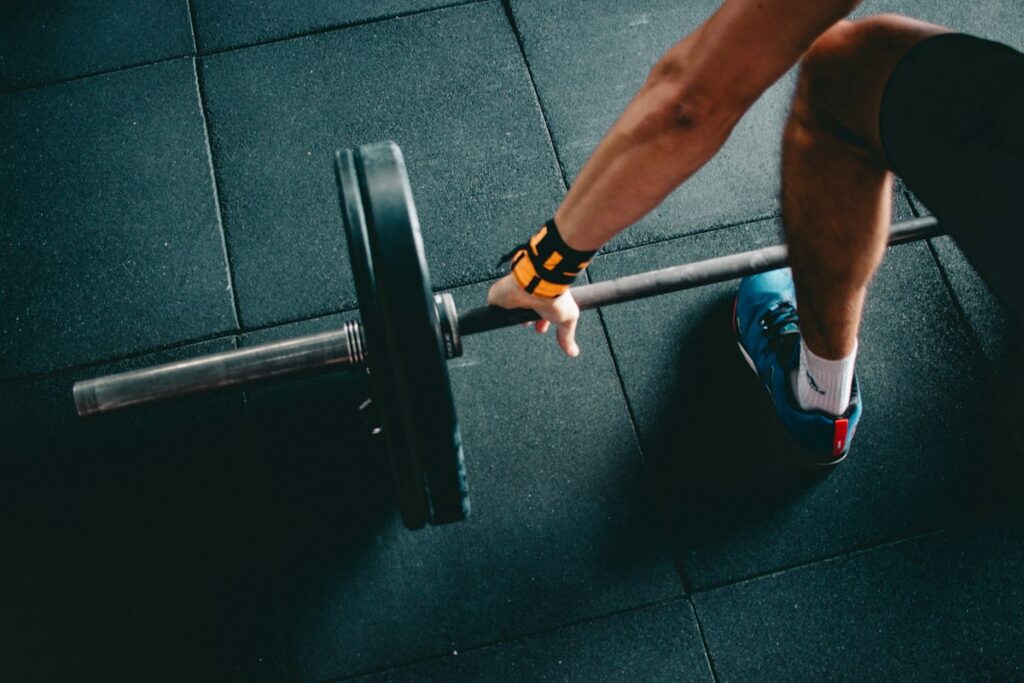 Athletic person training with kettlebell in a modern gym setting